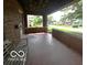 View of a covered porch featuring a bench and an open view of the neighborhood street at 1023 Franklin St, Columbus, IN 47201