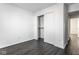 Bedroom with sliding closet doors and laminate wood floors at 1292 Bearsden Cir, Avon, IN 46123