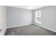 Spacious bedroom with grey carpet and neutral walls at 13678 Cunningham Dr, Carmel, IN 46074