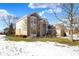 Two-story house with a partial view of the backyard and snow at 13678 Cunningham Dr, Carmel, IN 46074