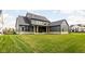 Large backyard with a grassy area and a partially visible patio at 14028 Grannan Ln, Carmel, IN 46074