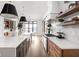 Modern kitchen with an expansive island, quartz countertops, and a large window at 14028 Grannan Ln, Carmel, IN 46074