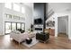 Spacious living room with a large fireplace, high ceilings, and hardwood floors at 14028 Grannan Ln, Carmel, IN 46074