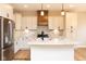 Modern kitchen featuring an island, stainless steel appliances, and light cabinetry at 1578 Palmetto Way, Greenfield, IN 46140