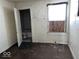 Bedroom with brown carpet and door to bathroom at 1610 Hoefgen St, Indianapolis, IN 46203
