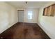 Empty bedroom featuring light walls, brown carpet, and natural light from the window at 1610 Hoefgen St, Indianapolis, IN 46203