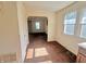 Hallway with light from the windows, brown carpet, and white walls at 1610 Hoefgen St, Indianapolis, IN 46203