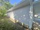 Close up side view of house exterior with siding and grass at 1610 Hoefgen St, Indianapolis, IN 46203