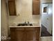Small kitchen with wood cabinets and double sink at 1610 Hoefgen St, Indianapolis, IN 46203