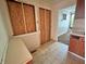 Kitchen with covered windows and dated cabinets is overdue for updating and is in need of repair at 1610 Hoefgen St, Indianapolis, IN 46203