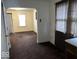 Kitchen with archway to adjacent room, dated cabinets at 1610 Hoefgen St, Indianapolis, IN 46203