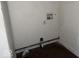 A simple laundry room with hookups for a washer and dryer at 1610 Hoefgen St, Indianapolis, IN 46203