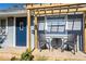 Inviting front porch with pergola, small table, and chairs at 1654 Iowa St, Indianapolis, IN 46203