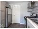 Modern kitchen with gray cabinets and stainless steel appliances at 1654 Iowa St, Indianapolis, IN 46203