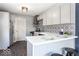 Updated kitchen featuring gray cabinets and stainless steel appliances at 1654 Iowa St, Indianapolis, IN 46203