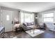 Cozy living room featuring a gray sofa and wood floors at 1654 Iowa St, Indianapolis, IN 46203