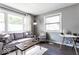 Comfortable living room with gray couch and wood flooring at 1654 Iowa St, Indianapolis, IN 46203