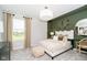Bright bedroom with a cozy bed and green accent wall at 18932 Seaforth Way, Westfield, IN 46074