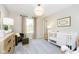 Bedroom featuring a crib, dresser, and calming decor at 18932 Seaforth Way, Westfield, IN 46074