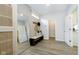 Bright entryway with built-in bench, mirror, and closet at 18932 Seaforth Way, Westfield, IN 46074