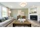 Living room with fireplace, large windows, and neutral decor at 18932 Seaforth Way, Westfield, IN 46074