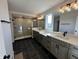 This bathroom features a walk-in shower, dual sinks, and modern fixtures at 19962 Stone Side Ct, Westfield, IN 46074