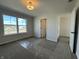 A light filled bedroom with large window and doorway to a possible ensuite bathroom at 19962 Stone Side Ct, Westfield, IN 46074