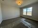 Bright bedroom with a large window that offers natural light and pleasant views of the neighborhood at 19962 Stone Side Ct, Westfield, IN 46074