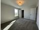 This bedroom has a nice-sized window and closet, plus neutral paint and carpet at 19962 Stone Side Ct, Westfield, IN 46074