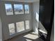 Great room boasting soaring ceilings, large windows, and a modern fireplace, creating a bright and airy living space at 19962 Stone Side Ct, Westfield, IN 46074