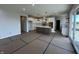 Open-concept kitchen with a large island, white cabinets, stainless appliances, and sliding glass door at 19962 Stone Side Ct, Westfield, IN 46074