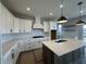 Bright, modern kitchen with quartz countertops, stainless steel appliances, and pendant lighting at 19962 Stone Side Ct, Westfield, IN 46074