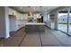 Well-lit kitchen featuring white cabinets, a center island, stainless steel appliances, and pantry at 19962 Stone Side Ct, Westfield, IN 46074