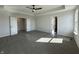 This spacious main bedroom features a ceiling fan and ensuite bathroom at 19962 Stone Side Ct, Westfield, IN 46074