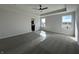 This main bedroom has a ceiling fan, large windows, and an ensuite bathroom at 19962 Stone Side Ct, Westfield, IN 46074