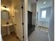 Powder room and mudroom with a modern pedestal sink, coat rack, and storage, combining style and function at 19962 Stone Side Ct, Westfield, IN 46074