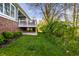 A backyard featuring a deck with white railings surrounded by lush greenery and trees at 20188 Hampton Park Dr, Westfield, IN 46074