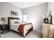 Cozy bedroom featuring natural textures, a wooden headboard, and neutral color palette at 20188 Hampton Park Dr, Westfield, IN 46074