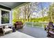 Covered porch with wooden chairs, a grill, and outdoor seating area at 20188 Hampton Park Dr, Westfield, IN 46074