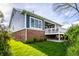 A deck with white railings and lush greenery in the well-maintained backyard at 20188 Hampton Park Dr, Westfield, IN 46074