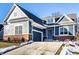 Inviting two-story home featuring a brick foundation, beautiful siding and a paved driveway at 20188 Hampton Park Dr, Westfield, IN 46074