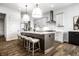 Bright kitchen showcasing a central island with bar stools and stainless steel appliances at 20188 Hampton Park Dr, Westfield, IN 46074