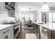 Open concept kitchen with modern appliances and seamless flow into dining area at 20188 Hampton Park Dr, Westfield, IN 46074