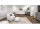 Bright living room features luxury vinyl plank flooring, a stylish armchair, and built-in wet bar at 20188 Hampton Park Dr, Westfield, IN 46074