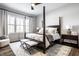 Serene bedroom with a four-poster bed, plush linens, and ample natural light at 20188 Hampton Park Dr, Westfield, IN 46074