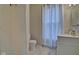 Clean bathroom with shower, toilet, and vanity at 2450 Carrollton Ave, Indianapolis, IN 46205