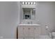 Bathroom with vanity, mirror, and toilet at 2450 Carrollton Ave, Indianapolis, IN 46205