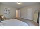 Bedroom with full bed and a full-length mirror at 2450 Carrollton Ave, Indianapolis, IN 46205