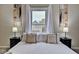 King size bed in a bright bedroom with window views at 2450 Carrollton Ave, Indianapolis, IN 46205