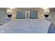 Cozy bedroom with a queen bed and nightstands with lamps at 2450 Carrollton Ave, Indianapolis, IN 46205